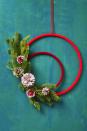 <p>Wrap two embroidery hoops — one small, one large — with different shades of red thread, and then finish it off with fresh or faux pine branches and a medley of hand-painted pinecones. </p><p><strong>RELATED: </strong><a href="https://www.goodhousekeeping.com/home/craft-ideas/how-to/g1488/diy-winter-wreaths/" rel="nofollow noopener" target="_blank" data-ylk="slk:Winter Wreaths That You Can DIY;elm:context_link;itc:0;sec:content-canvas" class="link ">Winter Wreaths That You Can DIY </a></p>