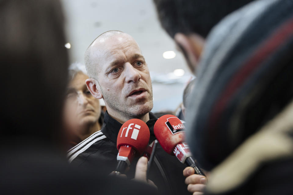 Palestinian French lawyer and activist Salah Hammouri talks with the press as he arrives at the Charles de Gaulle Airport after his extradition from Israel to France, Sunday, Dec. 18, 2022, in Paris. Israel said it deported Hammouri to France early Sunday, claiming he has ties to a banned militant group, despite objections from the French government. (AP Photo/Lewis Joly)