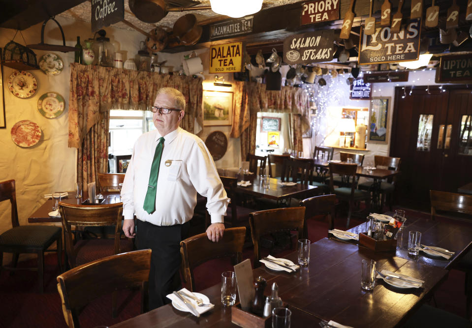 Barman Dominic Fitzpatrick of Fitzpatrick's pub poses for the media in the bar Wednesday, April, 5, 2023, near the village of Carlingford, Ireland. Fitzpatrick served the then Vice President Biden when he visited the pub in 2016. Excitement is building in Ballina, a small Irish town that was home to some of President Joe Biden's ancestors. Biden is scheduled to visit the town next week, part of a four-day trip to Ireland and neighboring Northern Ireland.(AP Photo/Peter Morrison)