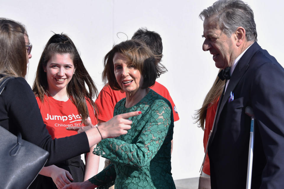 Speaker of the House Nancy Pelosi, D-Calif., third from left, arrives at at the John F. Kennedy Presidential Library and Museum with her husband Paul Pelosi, Sr., right, where she was to receive the 2019 John F. Kennedy Profile in Courage Award, Sunday, May 19, 2019, in Boston. (AP Photo/Josh Reynolds)