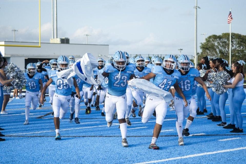 Dr. Joaquin Garcia High takes the field at the start of their first home game against Hollywood Hills High September 1, 2023, in Lake Worth.