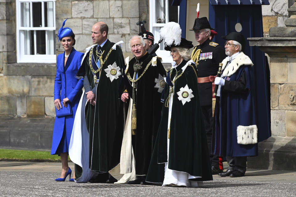 Britain's Prince William and Kate, Princess of Wales, known as the Duke and Duchess of Rothesay while in Scotland, and King Charles III, Queen Camilla, view the fly past by the Red Arrows outside the Palace of Holyroodhouse for the National Service of Thanksgiving and Dedication for King Charles III and Queen Camilla, and the presentation of the Honours of Scotland, in Edinburgh, Wednesday, July 5, 2023. (John Linton/Pool photo via AP)