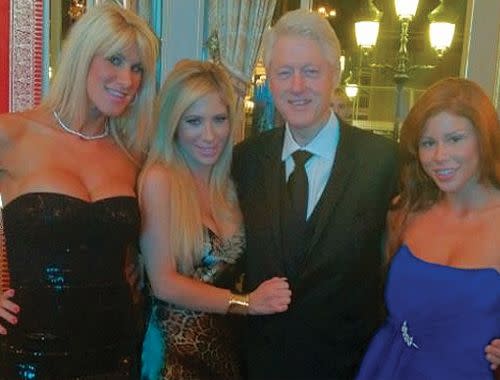 Bill Clinton posing with stars of the adult film industry. Credit: Twitter/Brooklyn Lee.