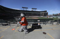 Lou Seal, the San Francisco Giants mascot, walks in the outfield stands during the fifth inning of a baseball game against the Colorado Rockies in San Francisco, Thursday, Sept. 24, 2020. (AP Photo/Jed Jacobsohn)