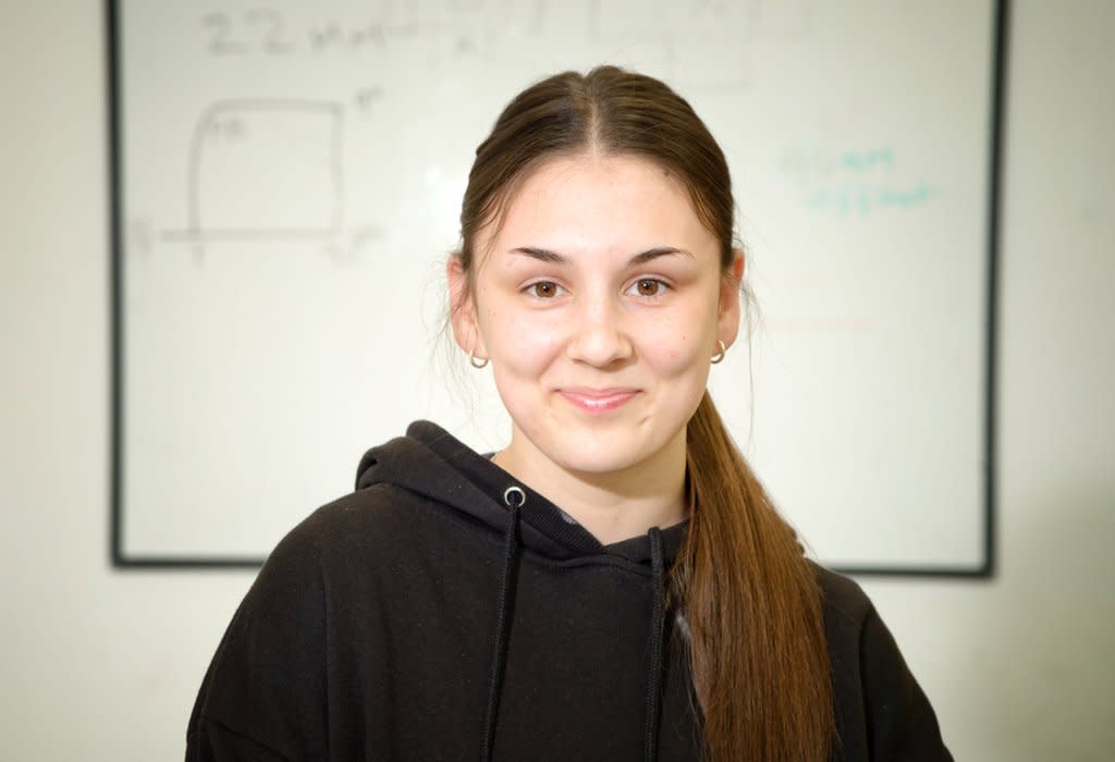 Chloe Green standing in one of the college's workshops