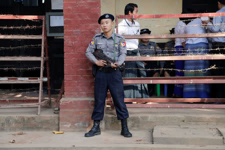 A police officer stands guard during the final verdict to the four accused for the murder of muslim lawyer Ko Ni, at Insein court in Yangon, Myanmar February 15, 2019. REUTERS/Ann Wang