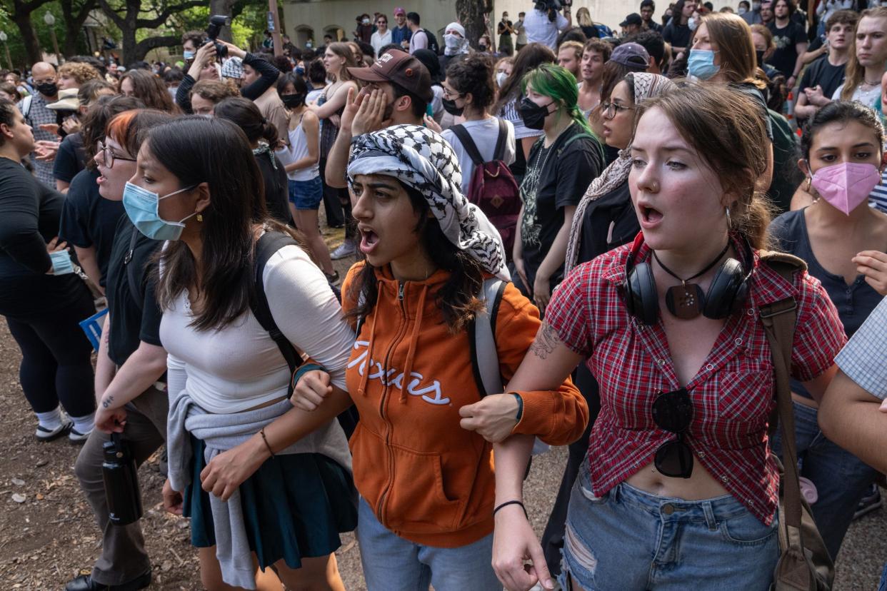 Tabeen Saiyed, middle, and Kaileen Rooks, right, chant at a pro-Palestinian protest at the University of Texas Wednesday April 24, 2024.