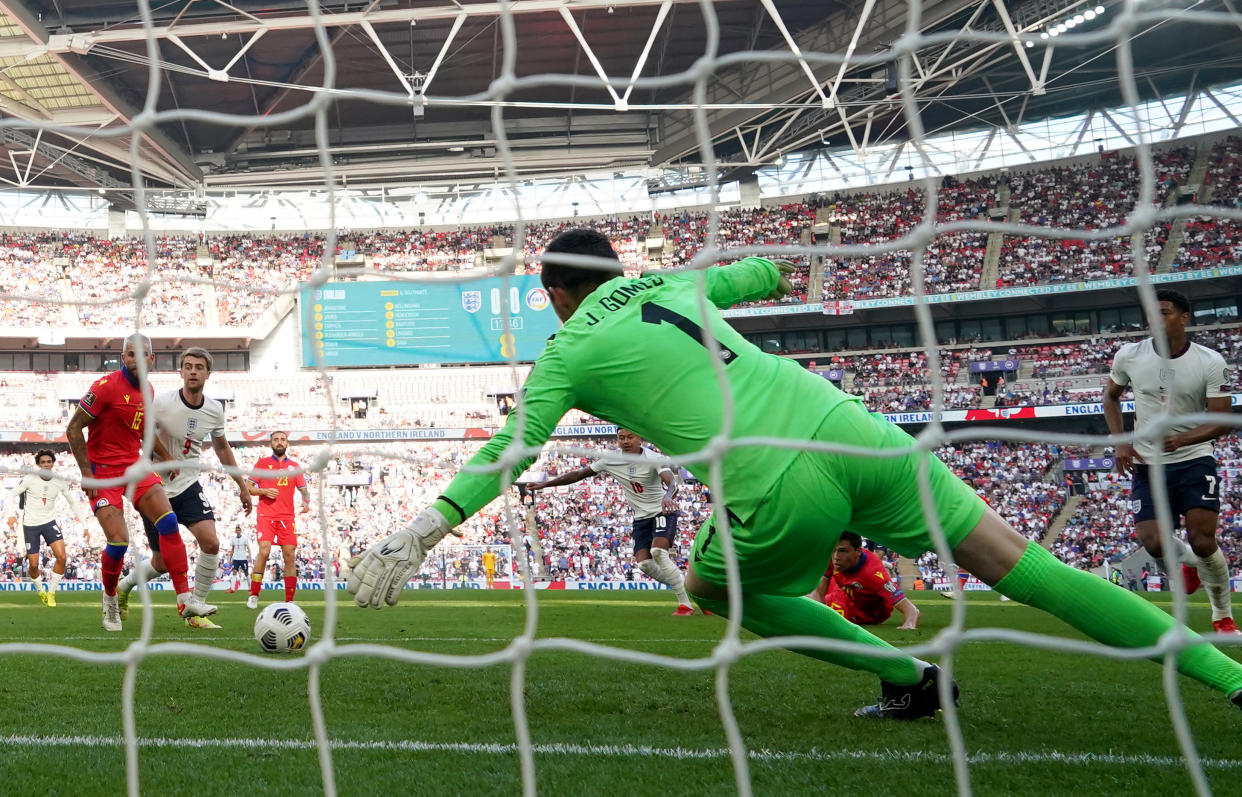 England's Jesse Lingard scores their side's first goal of the game.