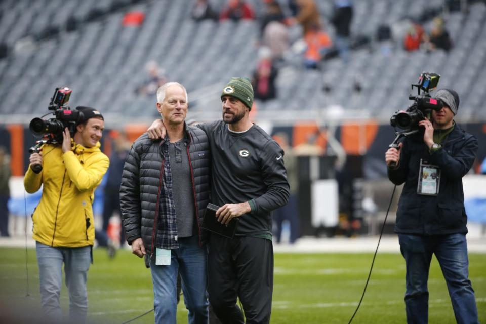 Green Bay Packers quarterback Aaron Rodgers, right, talk to ESPN's Kenny Mayne.