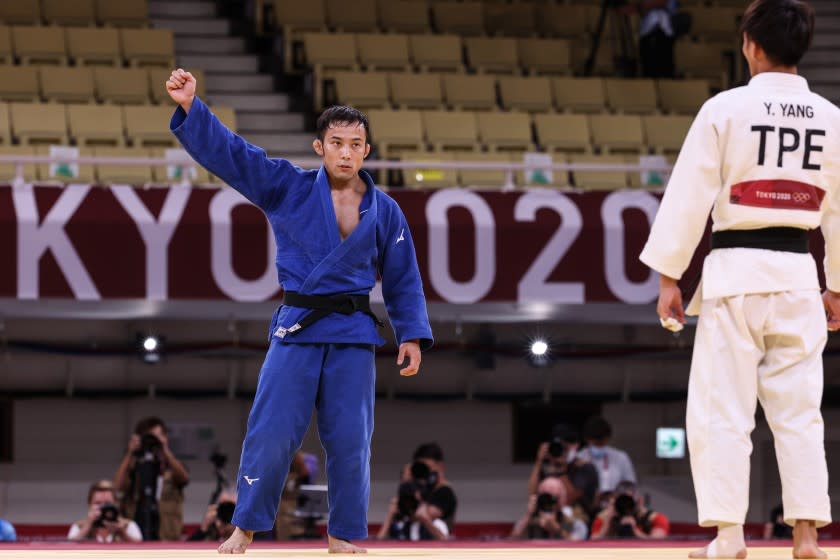 Tokyo, Japan, Friday, July 24, 2021 - Naohisa Takato of Japan battles celebrates after defeating Yung Wei Yang of Teipei in the Judo men's 60kg final. Takato won the gold medal by a Golden Score Nippon at Nippon Budokan at the Tokyo 2020 Olympics Opening Ceremony at Olympic Stadium. (Robert Gauthier/Los Angeles Times)
