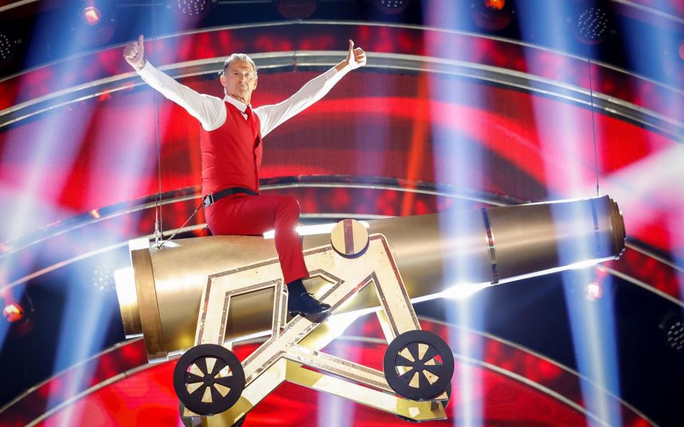 Tony Adams straddles a gold cannon - Guy Levy/BBC