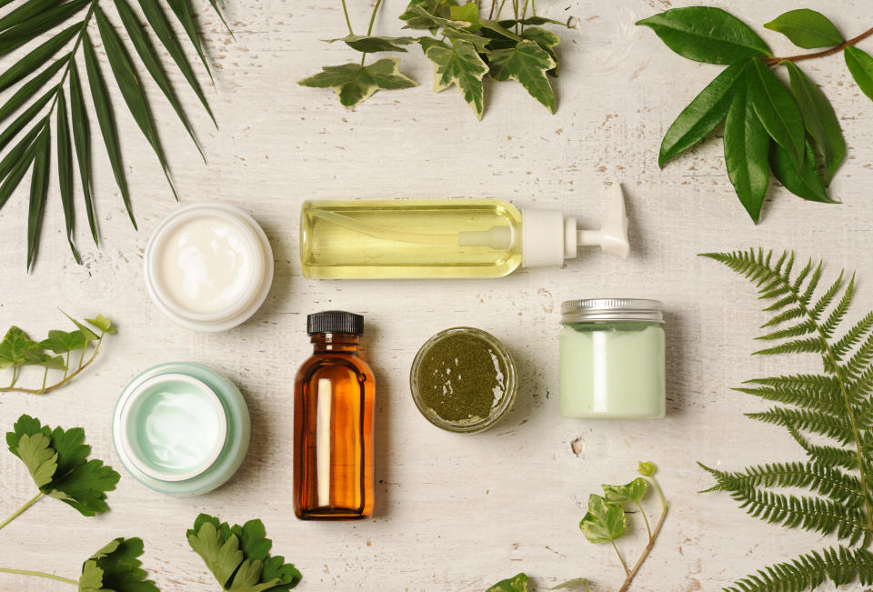 arrangement of natural herbal cosmetics on wooden background