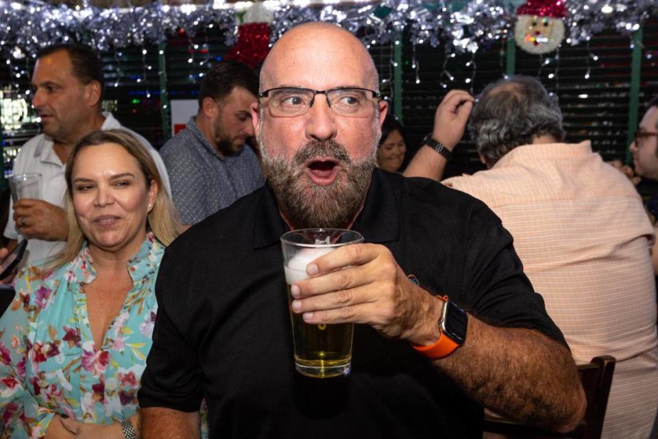 Apparent commissioner-elect Damian Pardo reacts to to the news of unseating incumbent Sabina Covo during a runoff election watch party for Miami’s District 2 seat at Flanigan’s in Miami, Florida, on Tuesday, November 21, 2023.