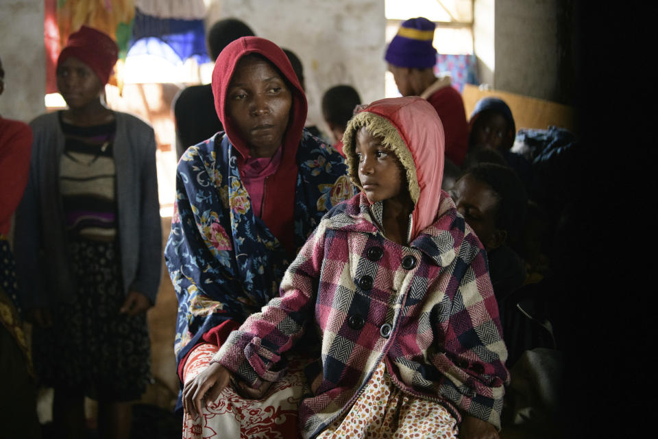 A mother and her child at a displacement center in Blantyre, Malawi Tuesday March 14, 2023. The unrelenting Cyclone Freddy that is currently battering southern Africa has killed more than 50 people in Malawi and Mozambique since it struck the continent for a second time on Saturday night. (AP Photo/Thoko Chikondi)