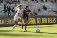 In this photo provided by Cal Athletics, University of California-Berkeley forward Amaya Gray, right, battles UC-San Diego's Katelyn Meyer for possession during an NCAA college soccer match at Edwards Stadium in Berkeley, Calif., Aug. 28, 2022. Nigel Wilson and twin sisters Anysa and Amaya Gray have been recognized for overcoming adversity to succeed on and off the field. Wilson, a basketball player for Pasadena City College, and the Gray twins, who play soccer for California, are this year's recipients of the CalHope Courage Award. They received their awards on Tuesday, May 9, 2023. (Al Sermeno/Cal Athletics via AP)
