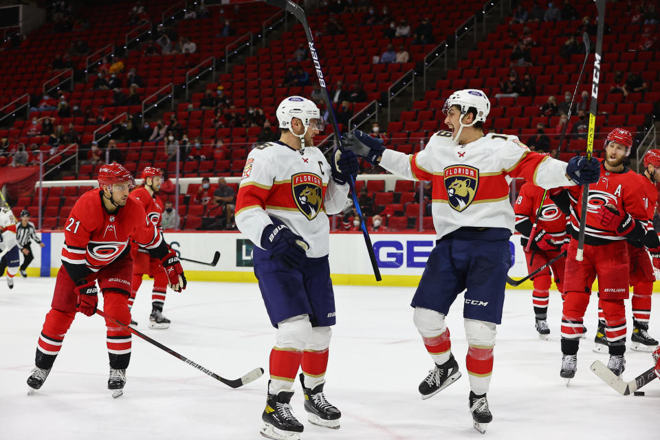 RALEIGH, NC - APRIL 06: Florida Panthers center Aleksander Barkov (16) and Florida Panthers left wing Mason Marchment (19) celebrate a goal during the 2nd period of the Carolina Hurricanes vs Florida Panthers on April 6th, 2021 at PNC Arena in Raleigh, NC (Photo by Jaylynn Nash/Icon Sportswire via Getty Images)