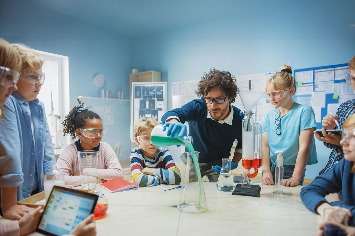 Science Teacher Shows Chemical Reaction Experiment To Children Getty Images/gorodenkoff