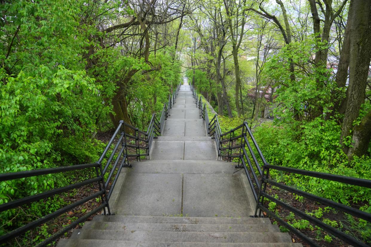 View looking south from Mount Auburn down the Main Street Steps to Over-the-Rhine, pictured, Wednesday, April 10, 2024, in Cincinnati. The stairs are the longest in Cincinnati, connecting five streets and the neighborhoods of Mount Auburn and Over-the-Rhine.
