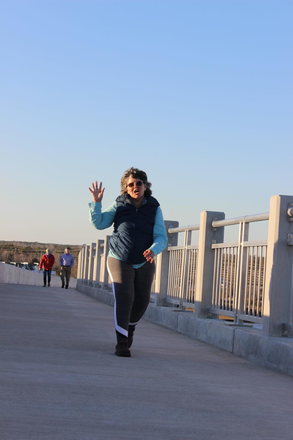 A walker crosses the Surf City bridge, which is included in a proposal for a 16-mile route for the East Coast Greenway.