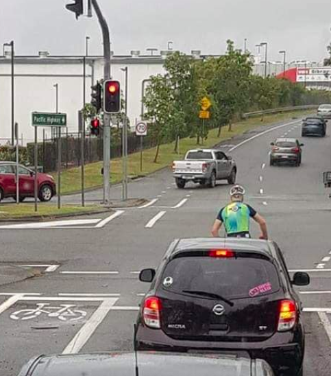 The cyclist waits at a set of traffic lights. Source: Facebook/ Dylan Yasar