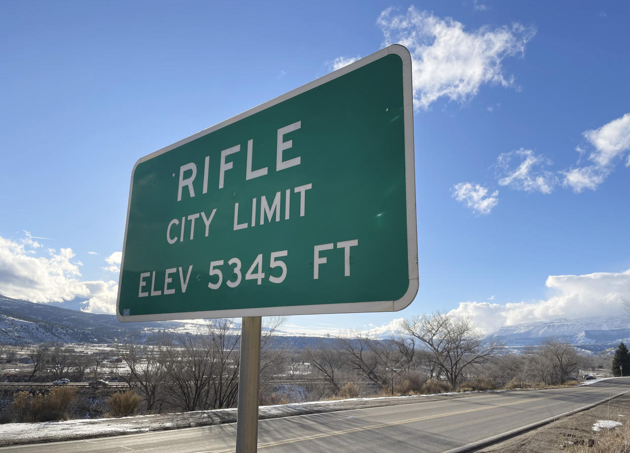 The city limit sign welcomes visitors on Thursday, Dec. 29, 2022, in Rifle, Colo. (AP Photo/Jesse Bedayn)