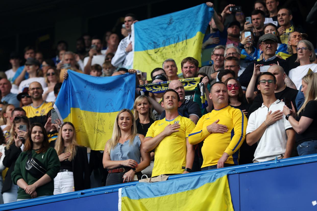 Ukraine fans sing the national anthem prior to the Game4Ukraine charity match (Chelsea FC via Getty Images)