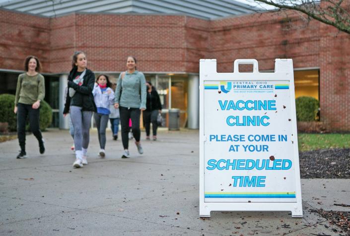 Families walk out of Central Ohio Primary Care where a pediatric vaccination clinic was hosted Saturday morning, the first of its Pfizer second-dose clinics in Westerville.