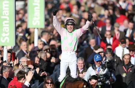 Horse Racing - Cheltenham Festival - Cheltenham Racecourse - 10/3/15 Ruby Walsh on Faugheen celebrates after winning the 15.20 Stan James Champion Hurdle Challenge Trophy Action Images via Reuters / Matthew Childs Livepic