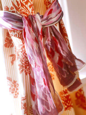Use small scarves to tie back curtains. 

Source
