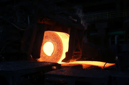 A steel coil is unrolled on the line at the Novolipetsk Steel PAO steel mill in Farrell, Pennsylvania, U.S., March 9, 2018. REUTERS/Aaron Josefczyk