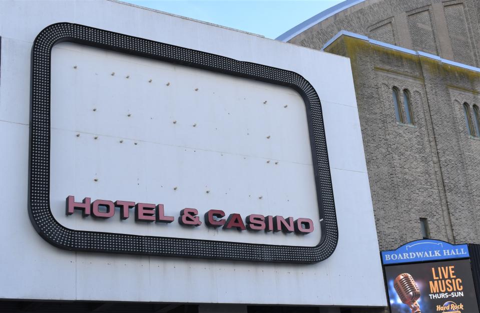 A roadside sign no longer promotes the Trump Plaza casino-hotel, which awaits demolition after closing in 2014.