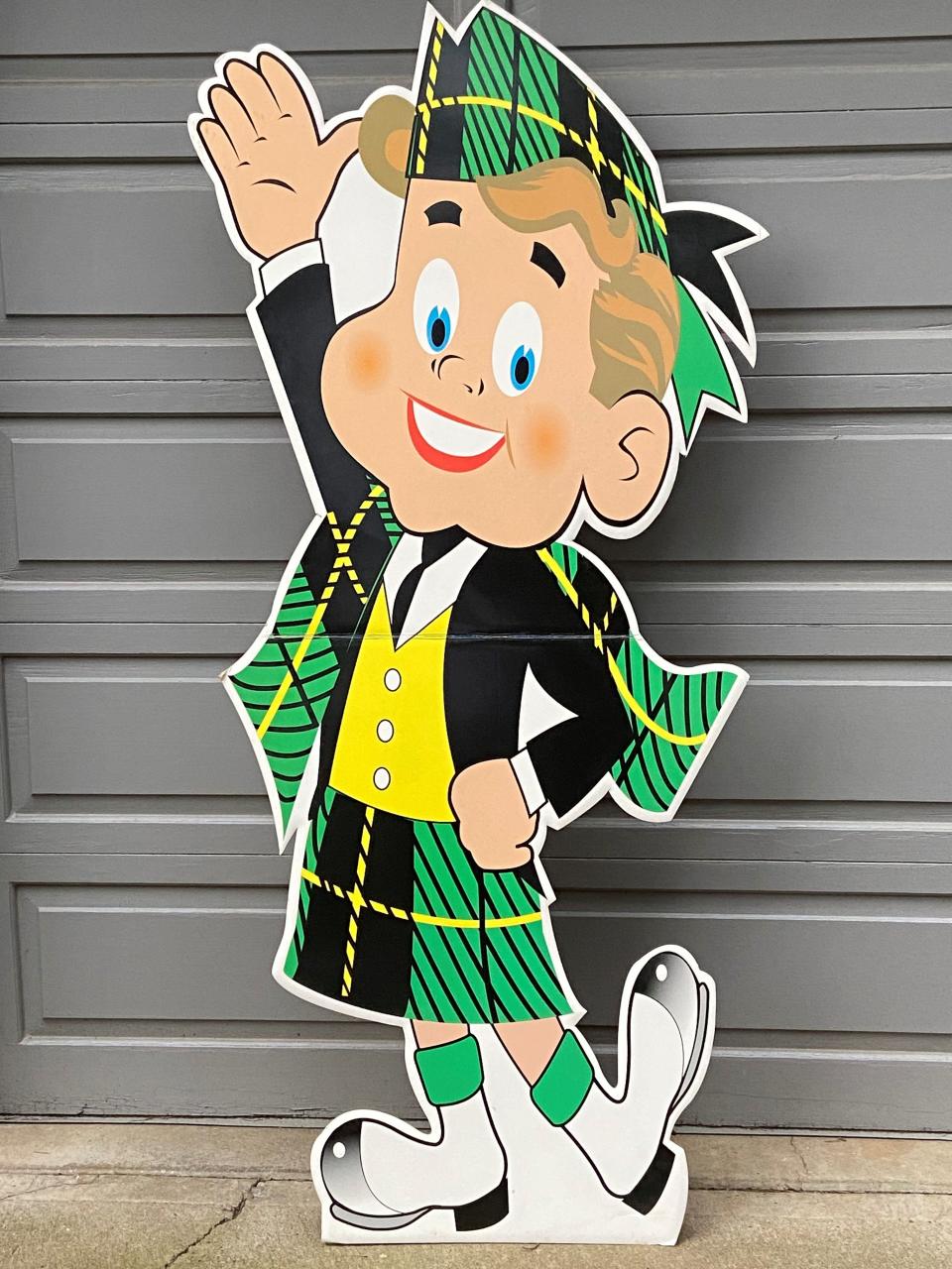 Co-owner Colleen Henery of Cooke Stationery Company is keeping this Scotty McTape cutout from the 1960s, promoting Scotch brand tape, as a memento from the family business.