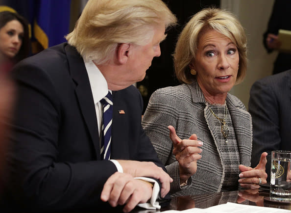 US Secretary of Education Betsy DeVos (R) speaks as President Donald Trump (L) listens during a parent-teacher conference listening session at the Roosevelt Room of the White House February 14, 2017 in Washington, DC. (Alex Wong/Getty Images)