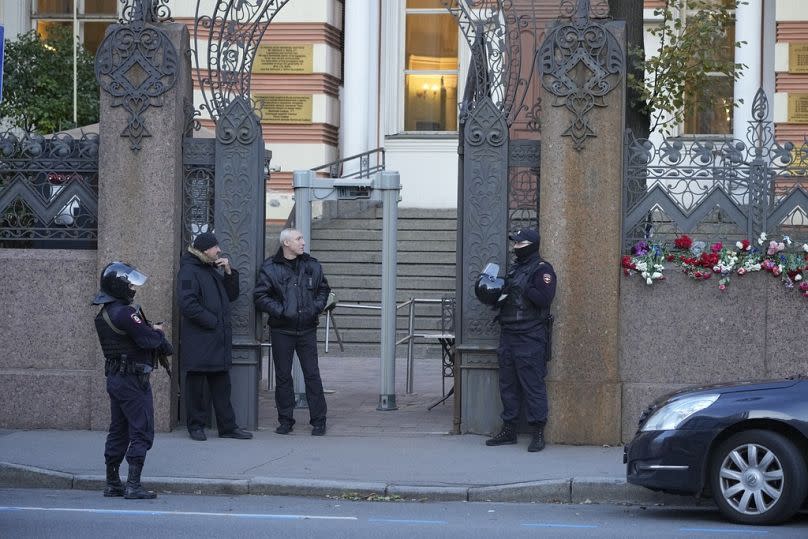 Armed police officers stand guard outside the main synagogue in St Petersburg, October 2023