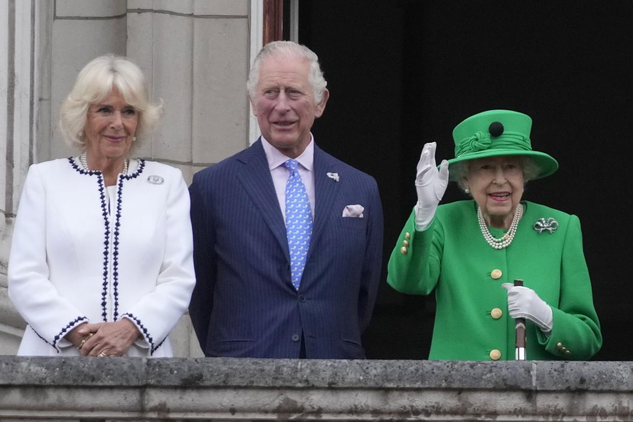 From left: Camilla Duchess of Cornwall, Prince Charles and Queen Elizabeth II appear on the balcony of Buckingham Palace during the Platinum Jubilee Pageant outside Buckingham Palace in London, Sunday June 5, 2022, on the last of four days of celebrations to mark the Platinum Jubilee. 