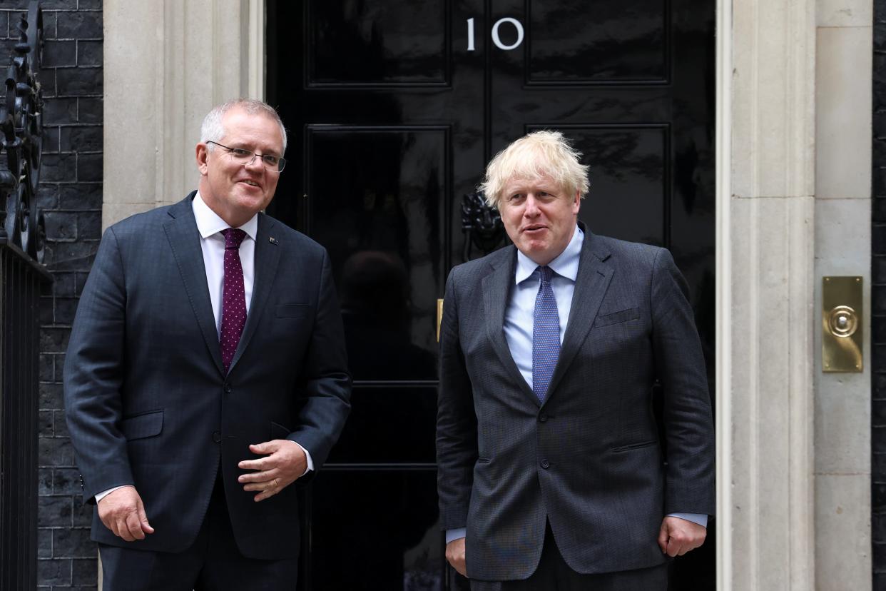 Boris Johnson and Scott Morrison, two founders of the new Indo-Pacific security alliance, in June  (Reuters)