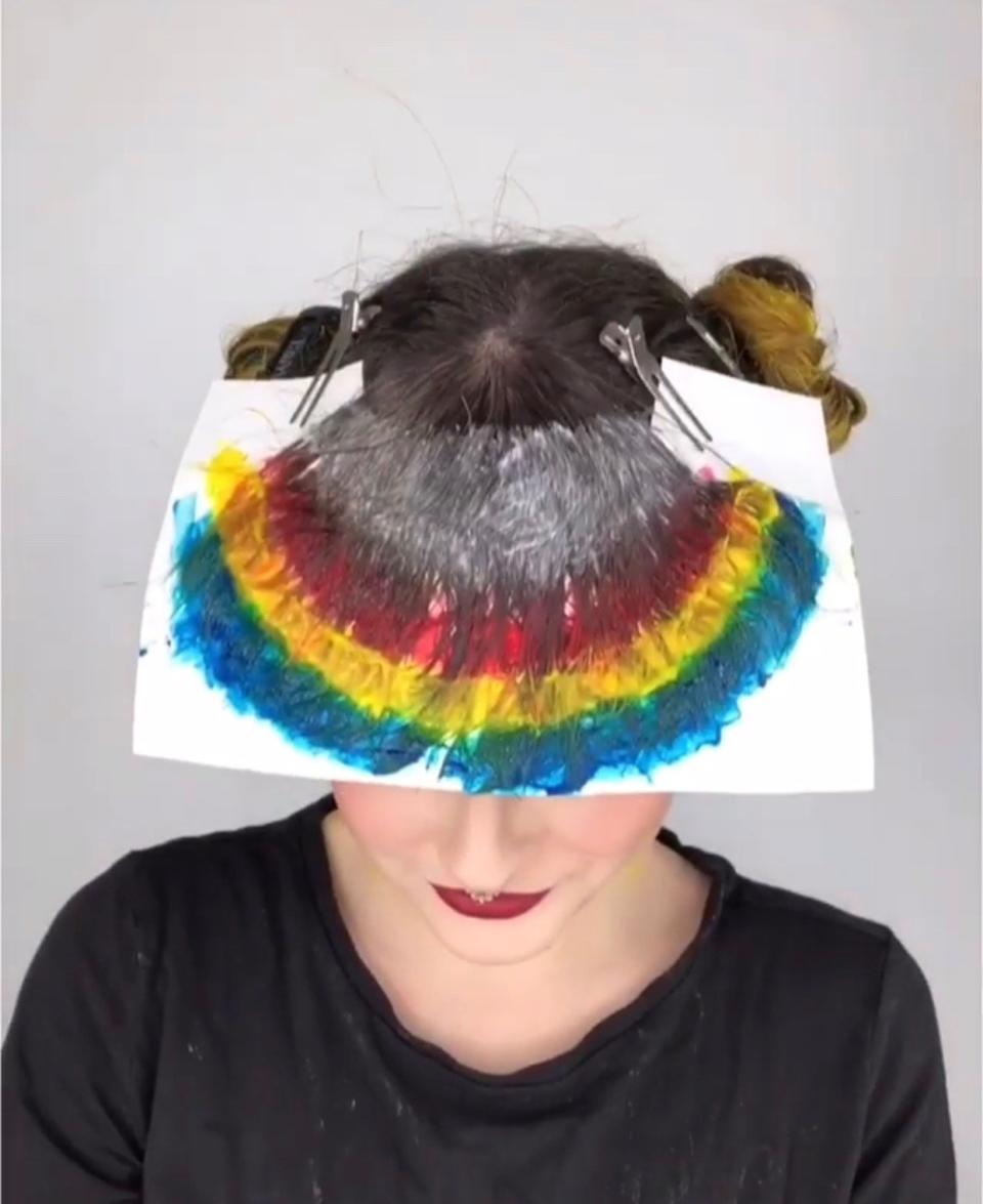 We chatted with St. Louis-based hair pro Caitlin Ford on how she mastered the creation of a rainbow bangs. See a video of her dyeing process here.