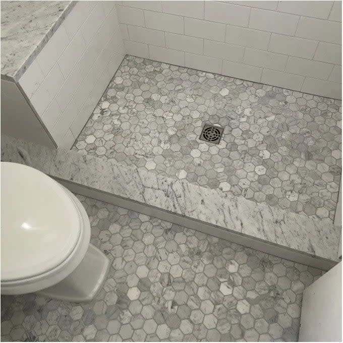 A reviewer photo of the tile on a bathroom floor and shower floor