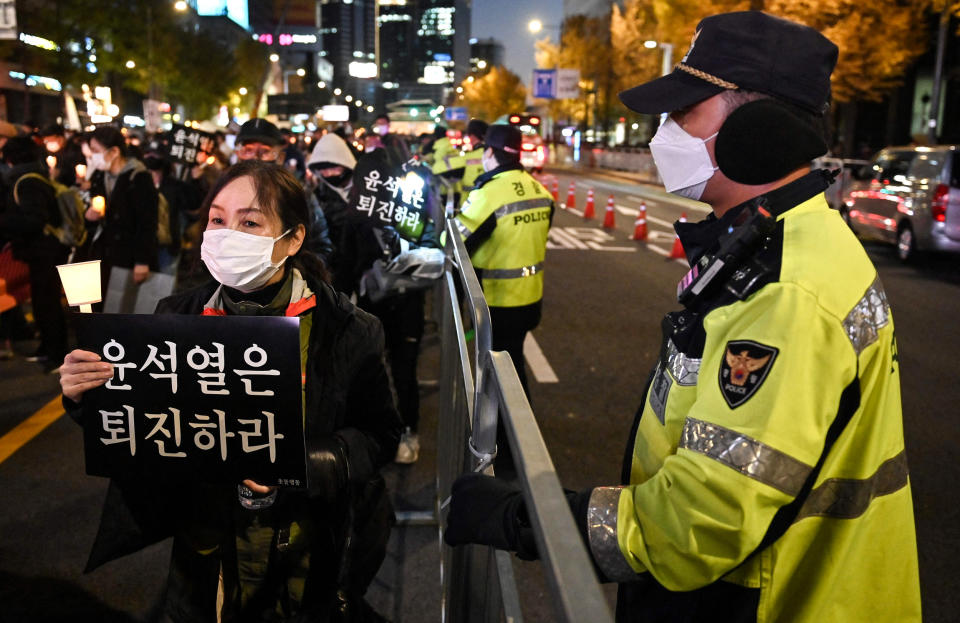 People take part in a candlelight vigil to commemorate the 156 people killed in the October 29 Halloween crowd crush in Seoul on Nov. 5, 2022. (Jung Yeon-je / AFP - Getty Images)