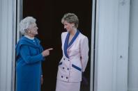 <p>The then-First Lady greeted Princess Diana at the White House in a blue long-sleeved dress and pearl necklace. The royal was wearing a blue and pink suit by Catherine Walker.</p>