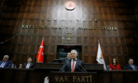 Turkey's Prime Minister Binali Yildirim addresses members of parliament from his ruling AK Party (AKP) during a meeting at the Turkish parliament in Ankara, Turkey, November 8, 2016. REUTERS/Umit Bektas