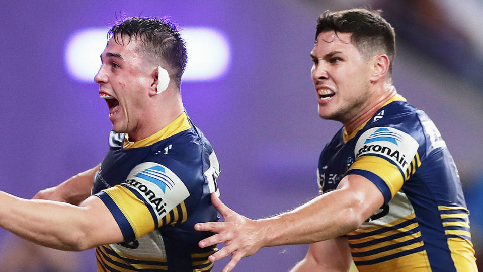 Pictured here, the Parramatta Eels celebrate during their round one victory in the NRL.