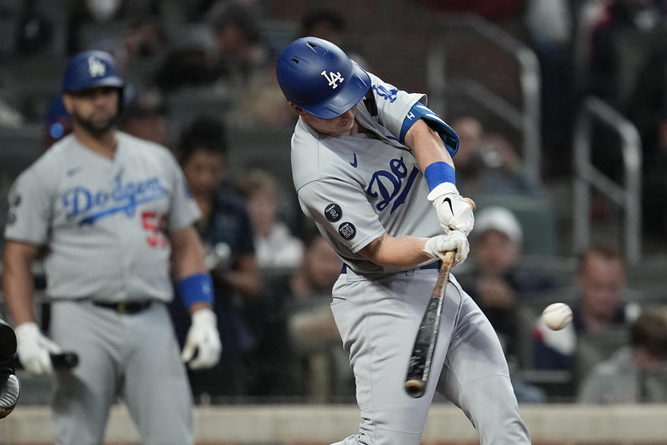 Los Angeles Dodgers' Will Smith hits a home run in the fourth inning in Game 1 of baseball's National League Championship Series against the Atlanta Braves Saturday, Oct. 16, 2021, in Atlanta. (AP Photo/Ashley Landis)