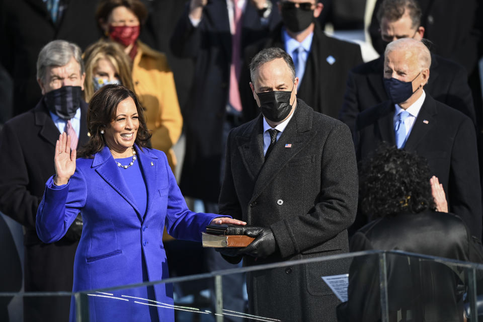 Kamala D. Harris and Doug Emhoff stand as she takes the oath of office. (Photo by Jonathan Newton/The Washington Post via Getty Images)