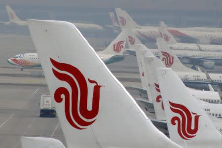 FILE PHOTO - Flights of Air China are parked on the tarmac of Beijing Capital International Airport in Beijing, China, March 28, 2016. REUTERS/Kim Kyung-Hoon/File Photo