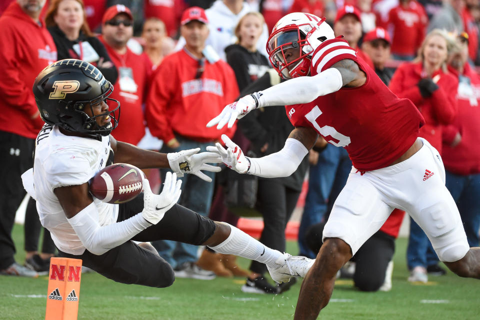 LINCOLN, NE - OCTOBER 30: Wide receiver David Bell #3 of the Purdue Boilermakers falls out of bounds on a catch attempt cornerback Cam Taylor-Britt #5 of the Nebraska Cornhuskers in the second half at Memorial Stadium on October 30, 2021 in Lincoln, Nebraska. (Photo by Steven Branscombe/Getty Images)