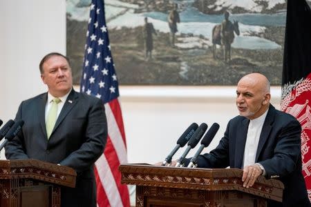 Afghan President Ashraf Ghani accompanied by U.S. Secretary of State Mike Pompeo speaks at a news conference at the Presidential Palace in Kabul, Afghanistan, July 9, 2018. Andrew Harnik/Pool via Reuters