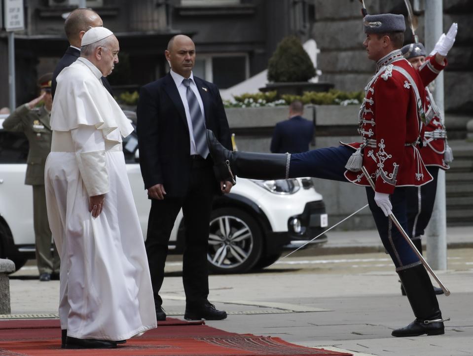 Pope Francis and Bulgaria's president, Rumen Radev review the honor guard as they arrive to the Presidential Palace in Sofia, Bulgaria, Sunday, May 5, 2019. Pope Francis is visiting Bulgaria, the European Union's poorest country and one that taken a hard line against migrants, a stance that conflicts with the pontiff's view that reaching out to vulnerable people is a moral imperative. (AP Photo/Alessandra Tarantino)
