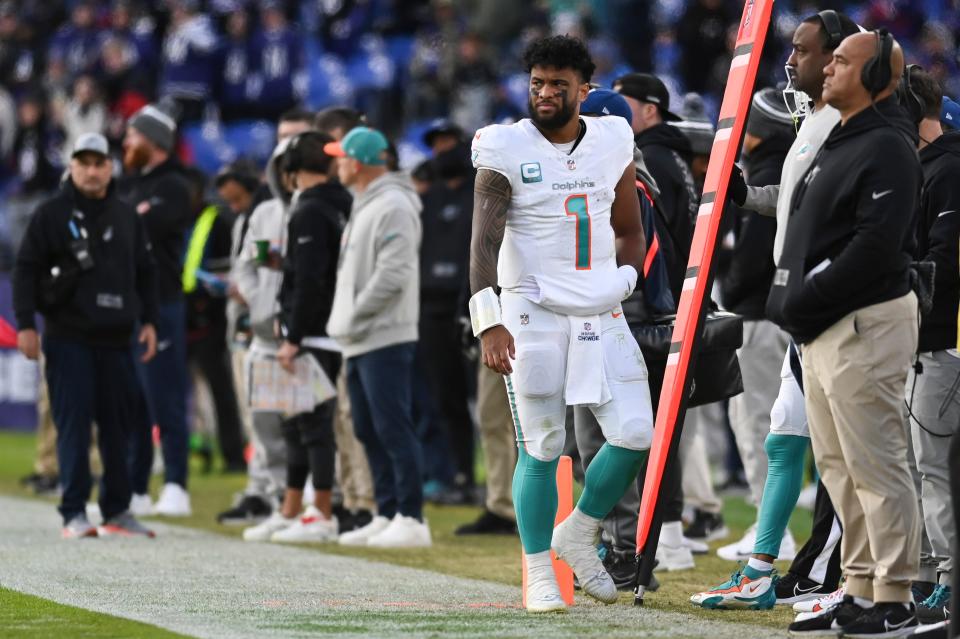 Miami Dolphins quarterback Tua Tagovailoa (1) walks down the sidelines during the second half against the Baltimore Ravens at M&T Bank Stadium.