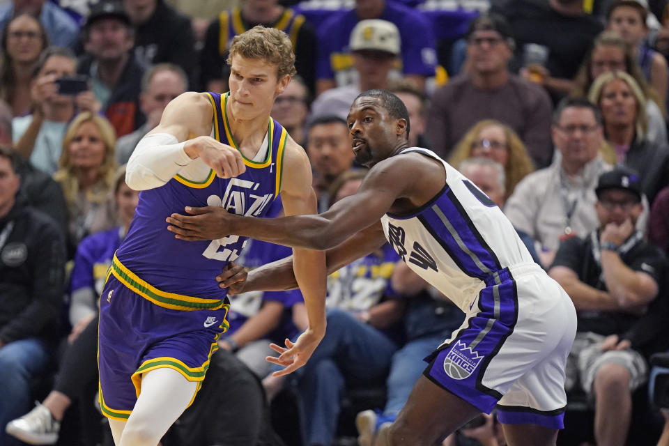 Sacramento Kings forward Harrison Barnes (40) guards Utah Jazz forward Lauri Markkanen, left, during the first half of an NBA basketball game Wednesday, Oct. 25, 2023, in Salt Lake City. (AP Photo/Rick Bowmer)